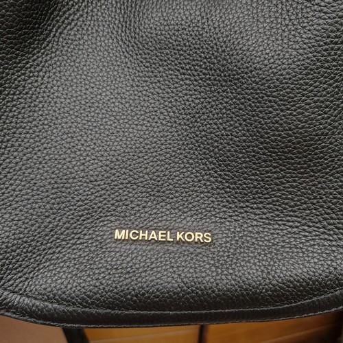 388 - A mixed lot of stylish ladies handbags including examples from Michael Kors, Jonathan Adler and Orla... 
