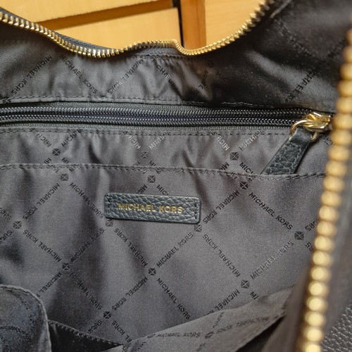 388 - A mixed lot of stylish ladies handbags including examples from Michael Kors, Jonathan Adler and Orla... 