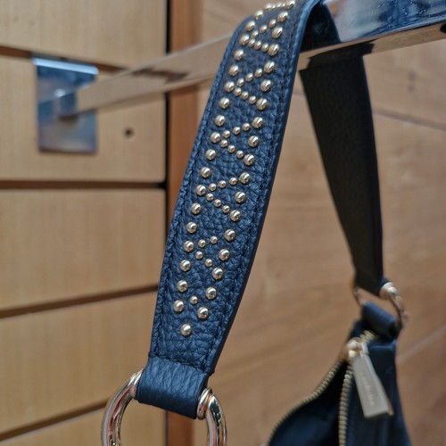 388 - A mixed lot of stylish ladies handbags including examples from Michael Kors, Jonathan Adler and Orla... 