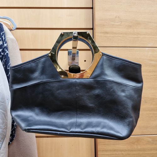 388 - A mixed lot of stylish ladies handbags including examples from Michael Kors, Jonathan Adler and Orla... 