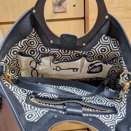 388 - A mixed lot of stylish ladies handbags including examples from Michael Kors, Jonathan Adler and Orla... 