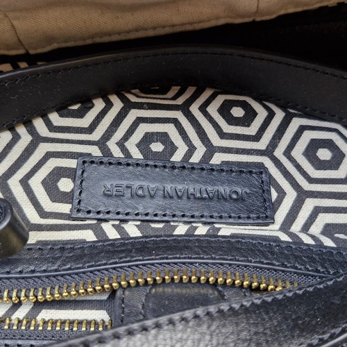 388 - A mixed lot of stylish ladies handbags including examples from Michael Kors, Jonathan Adler and Orla... 