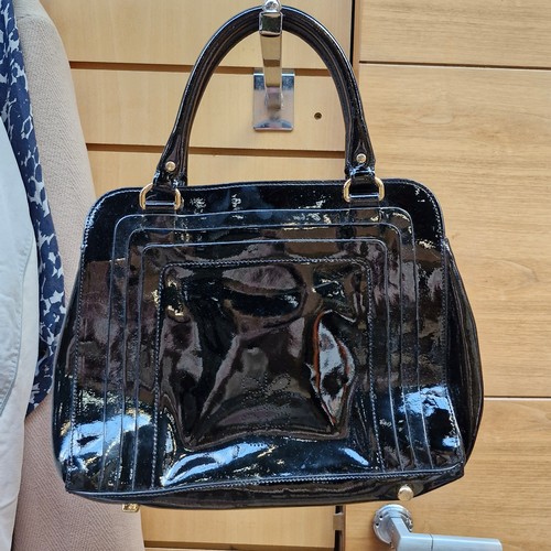 388 - A mixed lot of stylish ladies handbags including examples from Michael Kors, Jonathan Adler and Orla... 