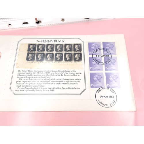 1036 - A fine album of mainly definite first day covers of Queen Elizabeth the 2nd mainly machine, fine iss... 