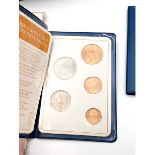 1034 - A box of commerative coins including 5 solid bronze large coins commemorating the launch of the pace... 