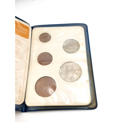 1034 - A box of commerative coins including 5 solid bronze large coins commemorating the launch of the pace... 