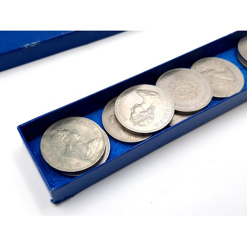 1034 - A box of commerative coins including 5 solid bronze large coins commemorating the launch of the pace... 