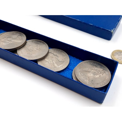 1034 - A box of commerative coins including 5 solid bronze large coins commemorating the launch of the pace... 