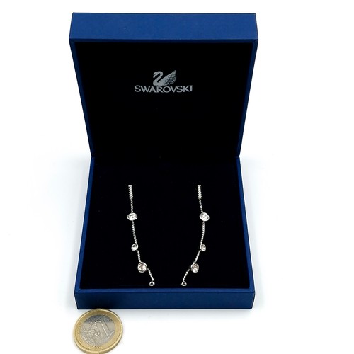 607 - A brand new pair of Swarovski Crystal graduated pendant earrings. Housed in original presentation je... 