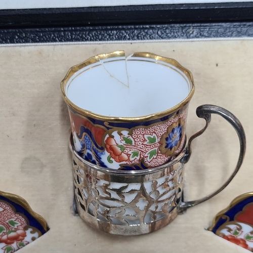 877 - Star Lot : A very pretty, early 20th century, Aynsley cup and saucer set with pierced sterling silve... 