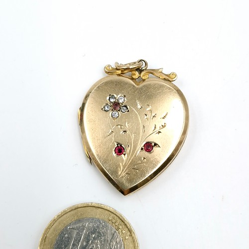 1 - A pretty 9ct gold front and back heart shaped pendant set with gemstone accents with foliate design.... 