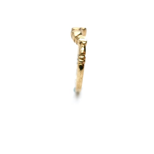 6 - A nine carat gold wishbone ring. Ring size - M1/2. Weight - 2.03g. Boxed.