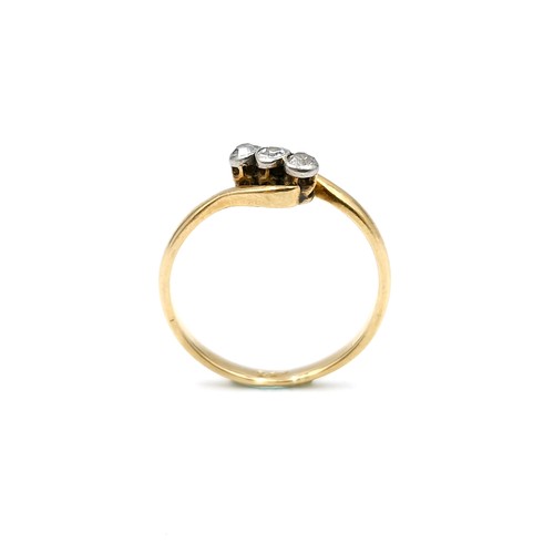 15 - Star Lot : An 18 carat gold ring set with three diamonds on a twist mount. Ring size - L. Weight - 1... 