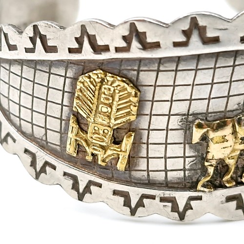 48 - A pretty sterling silver cuff bracelet with inlaid gold motifs and safety chain. Total weight 20 gra... 