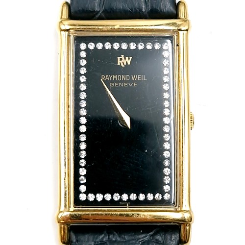 52 - Star Lot : A tank style wrist watch by  Raymond Weil Geneve. Watch with black face, gem set surround... 