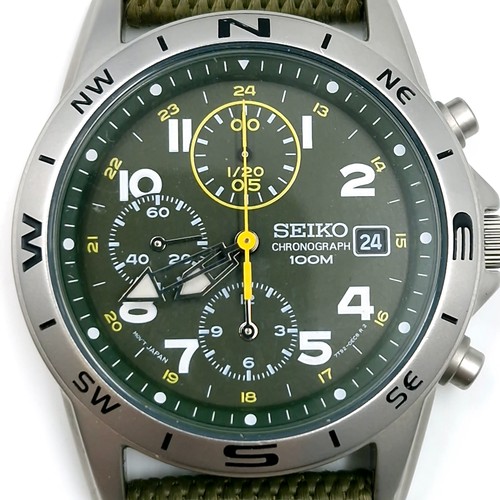 402 - A Seiko chronograph wrist watch with a waterproof depth of 100m. Comes with new web olive green stra... 