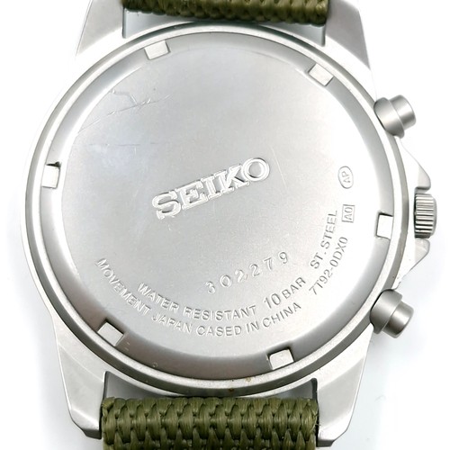 402 - A Seiko chronograph wrist watch with a waterproof depth of 100m. Comes with new web olive green stra... 