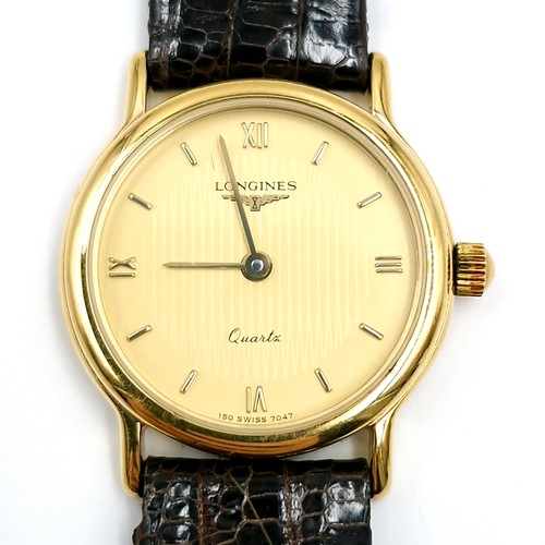 403 - Star lot : A Swiss made ladies Longines quartz wrist watch with original leather strap. Watch number... 
