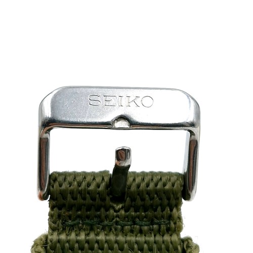402 - A Seiko chronograph wrist watch with a waterproof depth of 100m. Comes with new web olive green stra... 