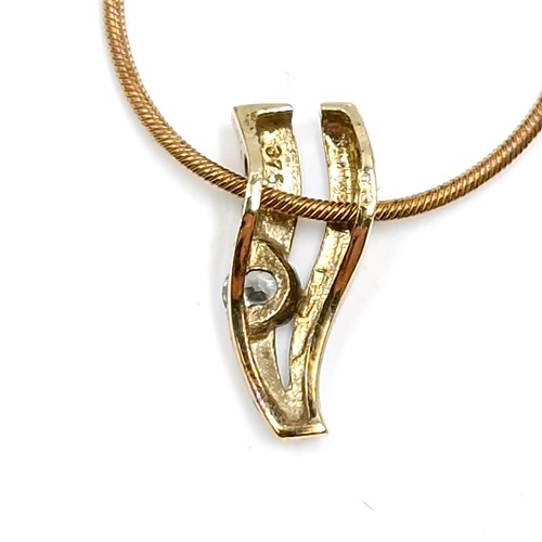 415 - Star Lot : A collection of items consisting of a nine carat gold (375) diamond pendant - Weight - 1.... 
