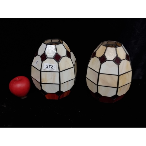 372 - A pair of Tiffany style stained glass pendant lampshades. In good condition. Could be pendent or tab... 