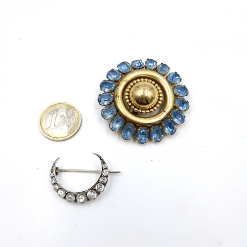 555 - Two vintage broaches including a large gold toned gemstone floral example. Both pins in tact.