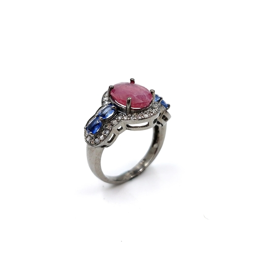 559 - Star lot : A most unusual 3.35ct ruby ring with .80ct kyanite stones and .40ct diamond, set in sterl... 