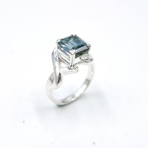 576 - A gorgeous 3ct emerald cut ocean blue moissanite stone ring set in sterling silver stamped 925. Ring... 