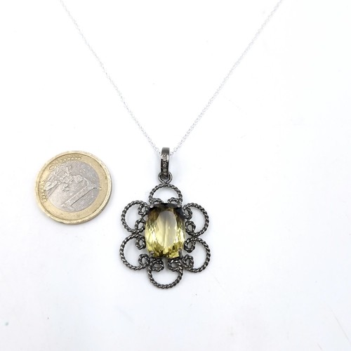 577 - An attractive 11ct lemon topaz gemstone necklace set with diamonds on loop, with sterling silver cha... 