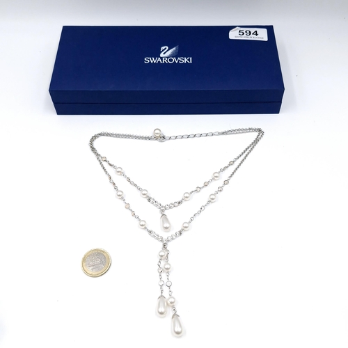 594 - A brand new elegant Swarovski Crystal doubled layered pearl necklace. Presented in original box with... 