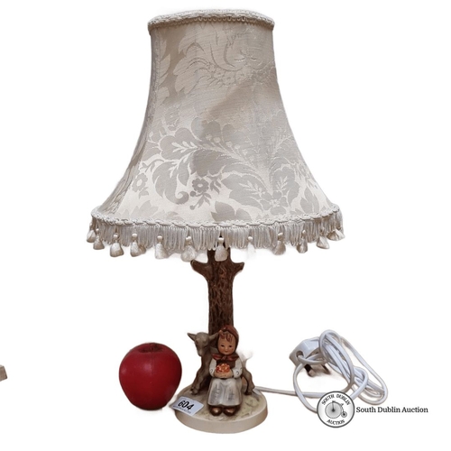 604 - A Hummel vintage Table lamp features a ceramic base depicting a child and deer, marked West Germany,... 