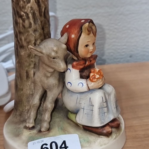 604 - A Hummel vintage Table lamp features a ceramic base depicting a child and deer, marked West Germany,... 