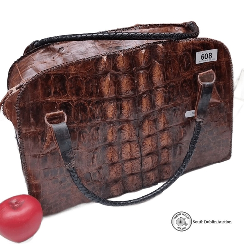 608 - Vintage crocodile leather handbag with top handles and zip closure, featuring a rich brown patina.