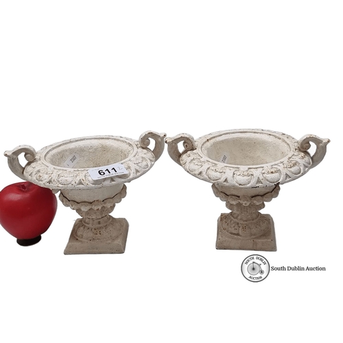 611 - Pair of vintage cast iron garden urns with ornate handles and decorative relief, approximately 7 inc... 