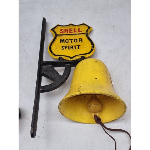 614 - Vintage style  Shell Motor Spirit cast iron hanging bell with vibrant yellow and red enamel accents.