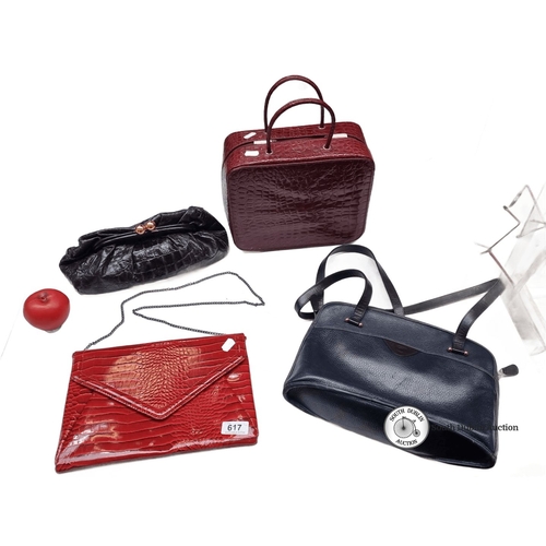 617 - Collection of four vintage handbags, featuring various styles and textures. Includes an Estée Lauder... 