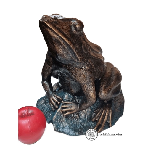 628 - A large heavy Bronzed  frog sculpture on a leaf base with patina finish.