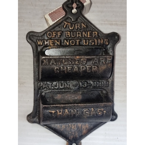 632 - Antique cast iron match holder featuring advertising slogan. Vintage design with compartments for ma... 