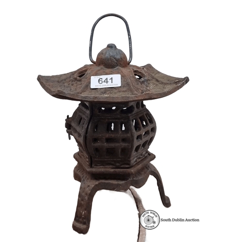 641 - Vintage cast iron lantern with intricate lattice design and curved roof. Rust patina enhances antiqu... 