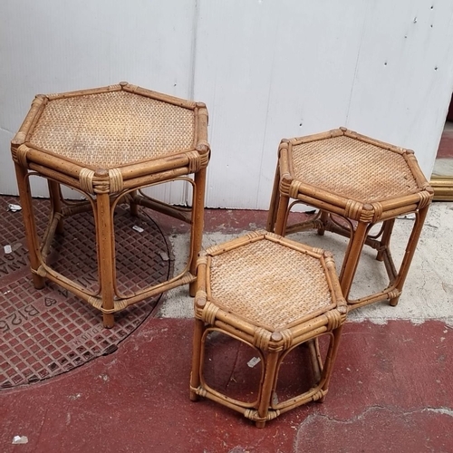 644 - Set includes two wicker baskets, a woven mat, and three hexagonal rattan nesting tables.