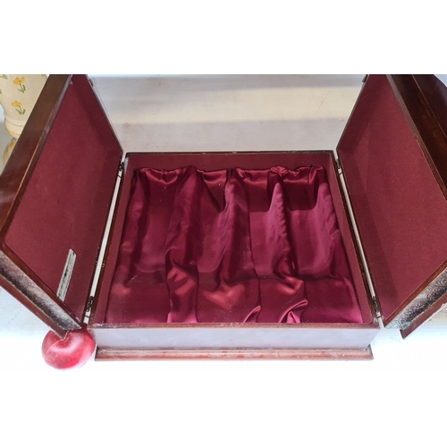 652 - Wooden box with ornate brass detailing and a burgundy interior lining.