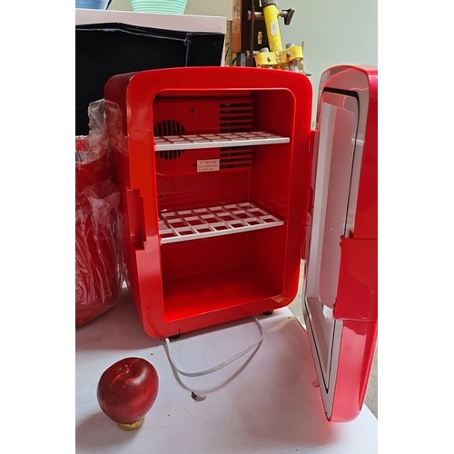 655 - New Budweiser promotional mini fridge and two matching red ice buckets. The fridge features interior... 