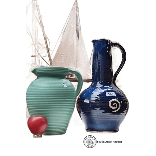 659 - Two studio art  pottery jugs: one green ribbed ceramic and one blue ceramic by Jack O Patsy Pottery,... 