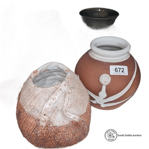 672 - Collection of four ceramic vases with textured surfaces, one stamped 