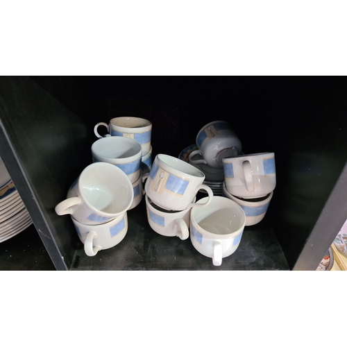 684 - Includes plates and mugs with blue and gold decorative design.