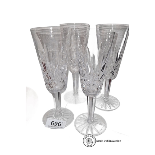 696 - Set of four tall Waterford crystal wine glasses  with intricate cut patterns.