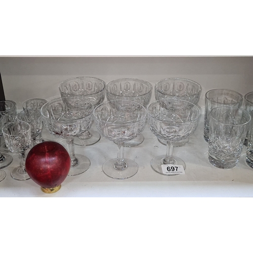 697 - Three sets of Crystal glassware set, featuring wine glasses, coupe glasses, and tumblers with intric... 