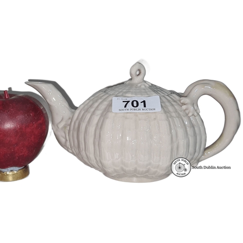 701 - Star Lot : A black mark Belleek porcelain teapot, pumpkin shape. Marked 