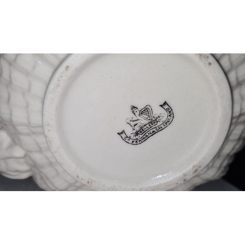 701 - Star Lot : A black mark Belleek porcelain teapot, pumpkin shape. Marked 