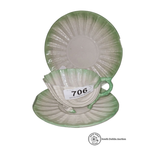 706 - A beautiful Black Mark Green and white shell motif tea set. The set includes a footed cup, saucer, a... 